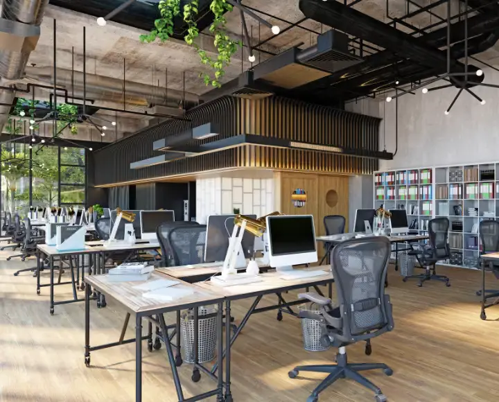 Open space de bureaux aménagé avec mezzanine, bibliothèque et luminaires